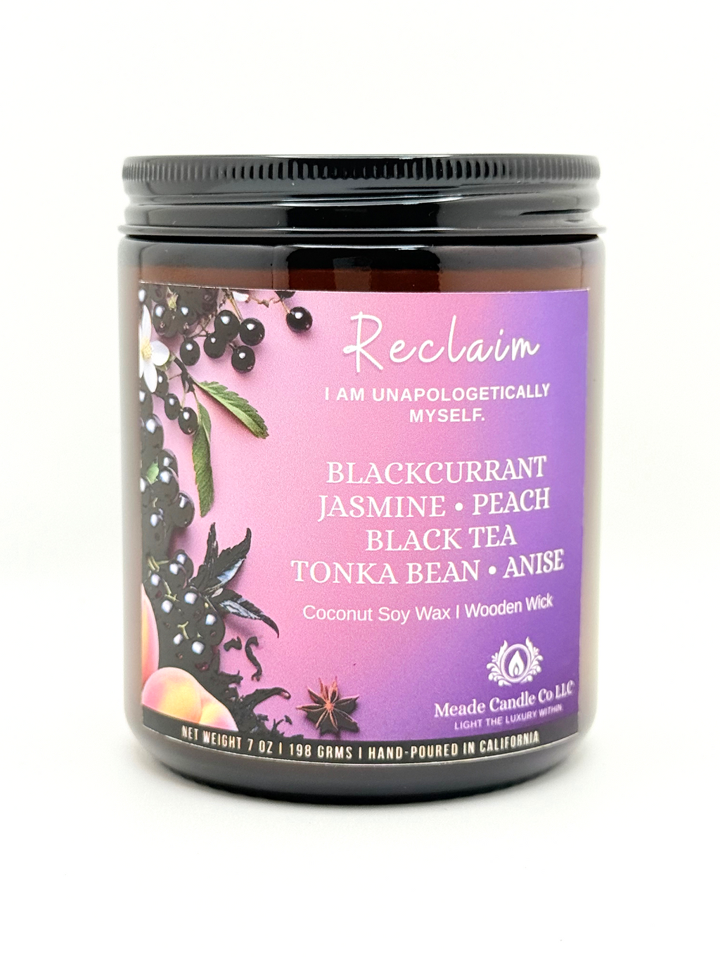 Scented candle jar with a 'Reclaim' label.