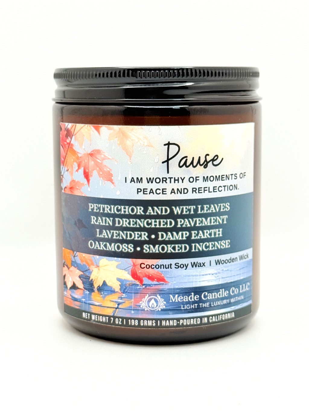 Scented candle jar with a 'Pause' label.