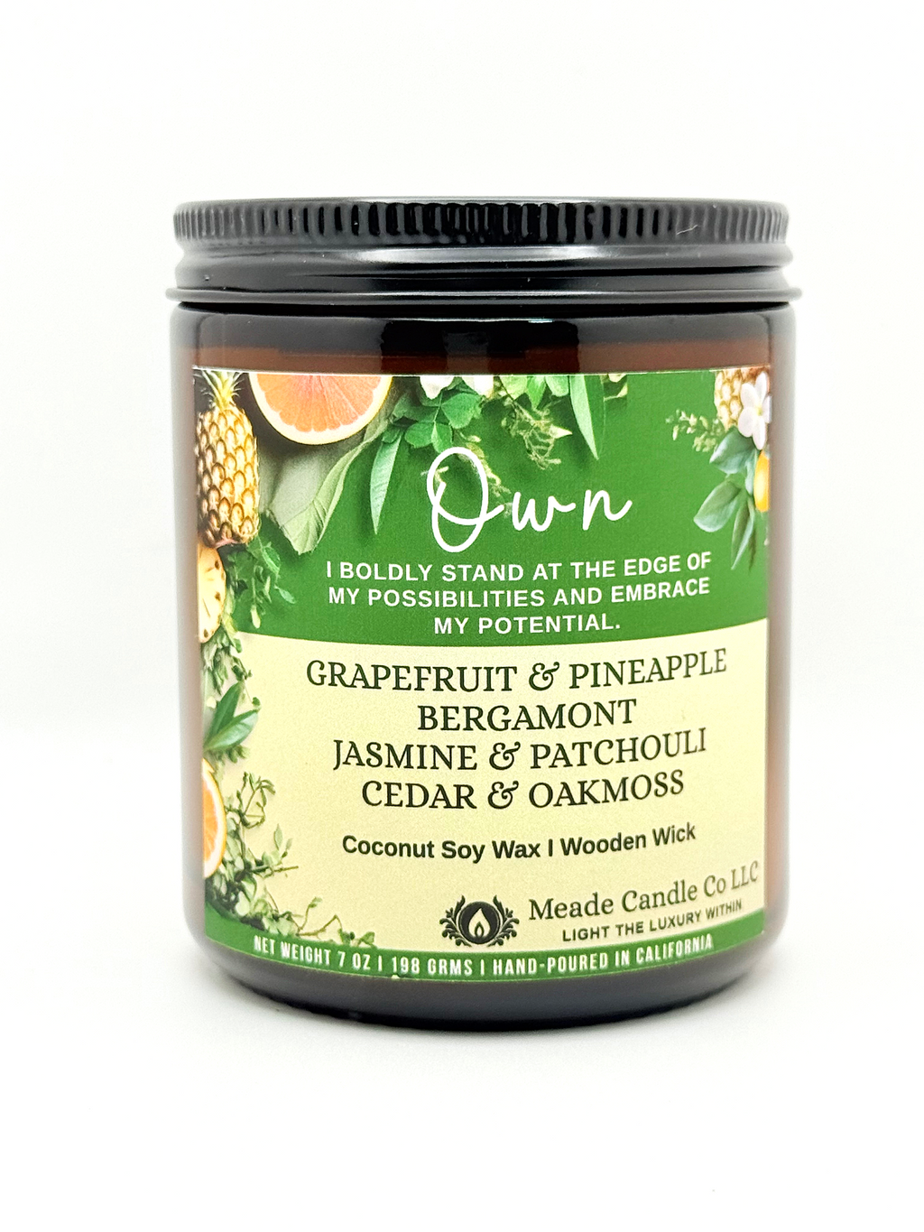 Scented candle jar with 'Own' label.