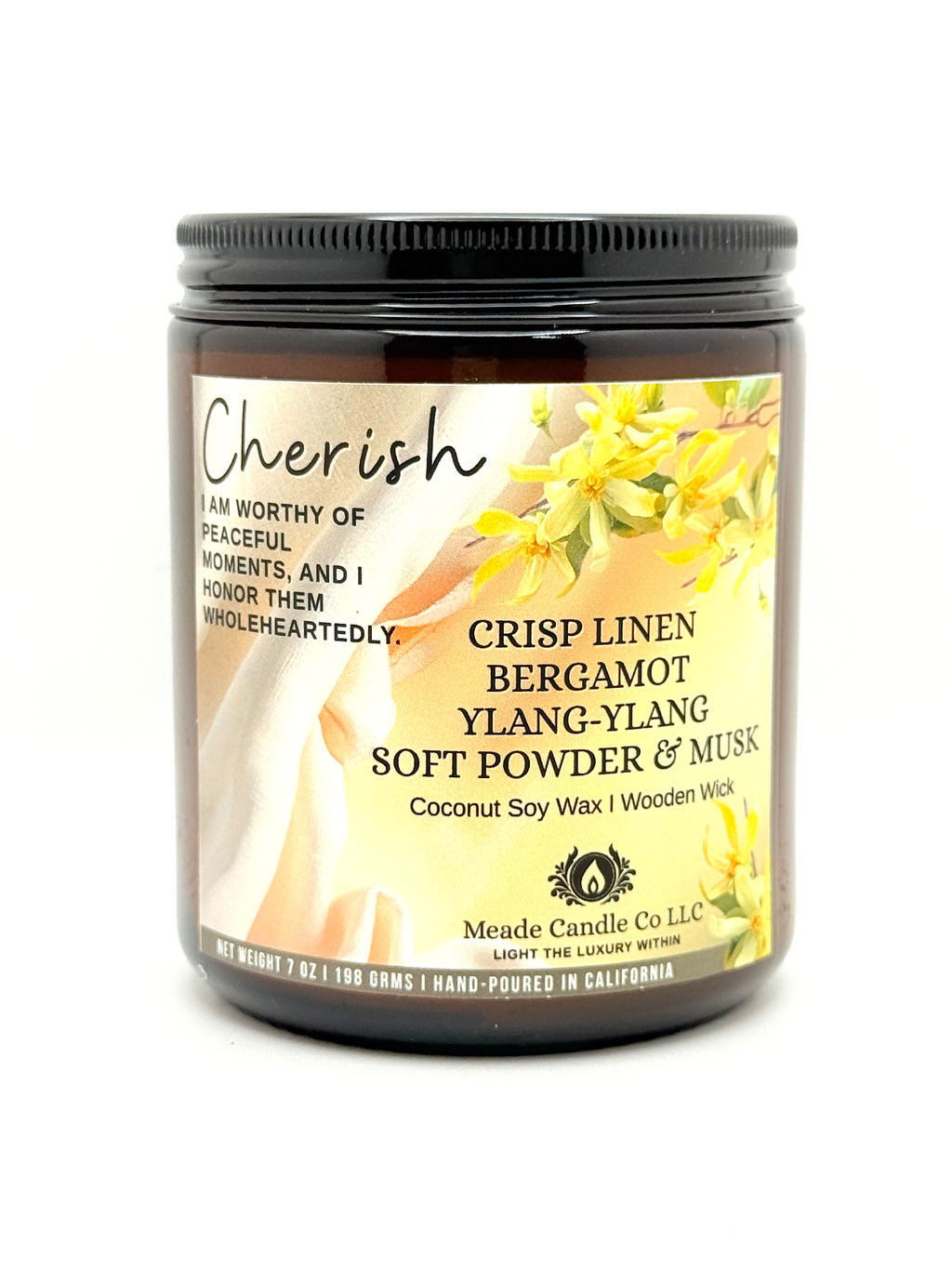 Scented candle jar with 'Cherish' label.